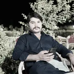 Man sitting outside at night with phone