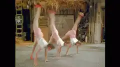 Three women in pink doing cartwheels and backbends