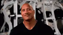 The Rock smiling in the gym
