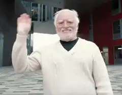 Old man waving hello