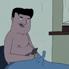 Man in bed looking at phone