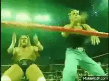 wrestler kicks opponent in the face