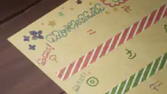 Hand stamping a wooden stamp on a colorful paper