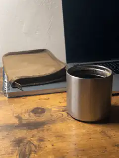 coffee cup on wooden desk