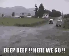 VW Bus splashes through puddle