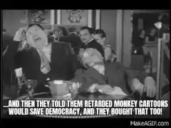 Two men laughing hysterically at a table