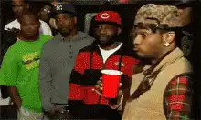 Soulja Boy sips red cup and looks around