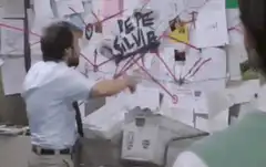 Charlie Day pointing at Pete Silveira board