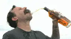 man chugging beer messily