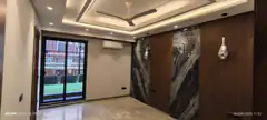 Modern living room with marble and wood paneling