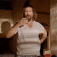 The Dude drinks and spits out liquid