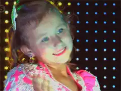 Little girl in pink dress posing