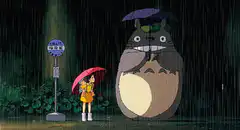 Totoro and Mei at the bus stop in the rain
