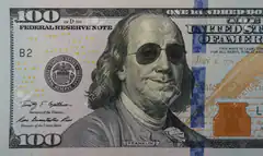 Benjamin Franklin on $100 bill with sunglasses