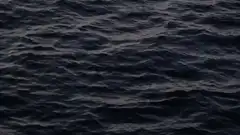 Dark ocean waves at night