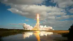 rocket launch with smoke and reflection