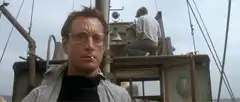 Roy Scheider on boat smoking cigarette