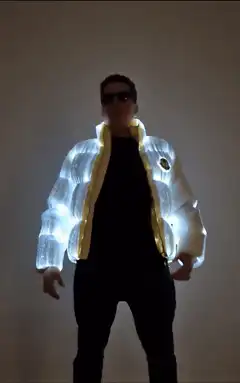 Man in glowing fiber optic jacket