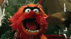 Animal from the Muppets playing drums