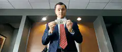 Leonardo DiCaprio throws money in trash