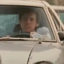Jim Carrey driving and looking confused