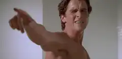 Christian Bale pointing and laughing