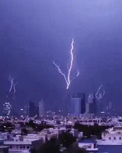 Lightning storm over city skyline