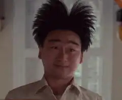 Man with spiky hair smiling