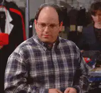 Cosmo Kramer coughing and clutching chest