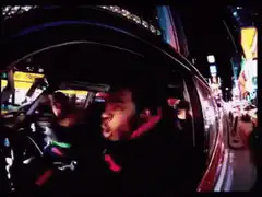 Man singing in car at night