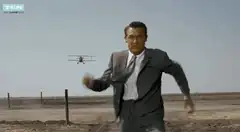 Man running from biplane