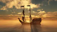 Silhouette of a pirate ship at sunset