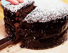 Slice of chocolate cake being lifted