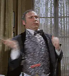 Man in tuxedo holding a banana