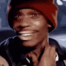 Dave Chappelle smiling and nodding