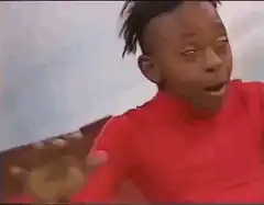Young boy dabbing in red shirt