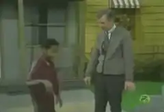 Mr. Rogers and a boy dancing