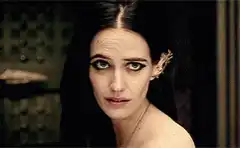 Eva Green smiles and looks away