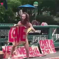 Bearded man in LOVE costume dancing