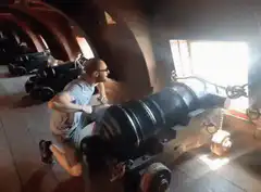 man firing cannon in fort