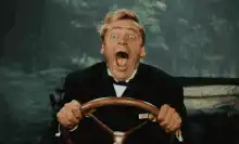 Man screaming while driving a car