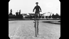 Man riding a penny-farthing bicycle