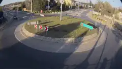 Car flies over roundabout