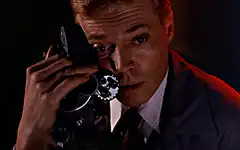James Stewart looking through binoculars