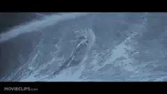 Surfer riding a giant wave