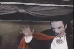 Dracula bites a woman's leg