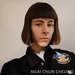 Person with bob haircut tilting head
