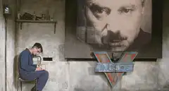Winston Smith writing under Big Brother
