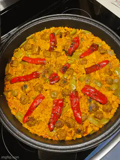 paella with meatballs and peppers