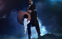 The Weeknd pouring water from a jug